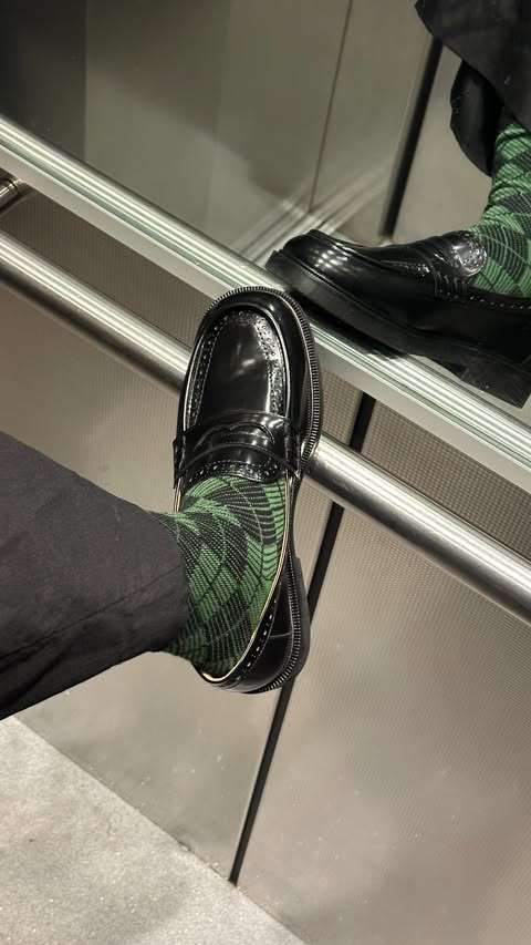 Instagram post by @e1isabethng for Happy Socks. Caption reads: [...] socks up with the original sock icons....