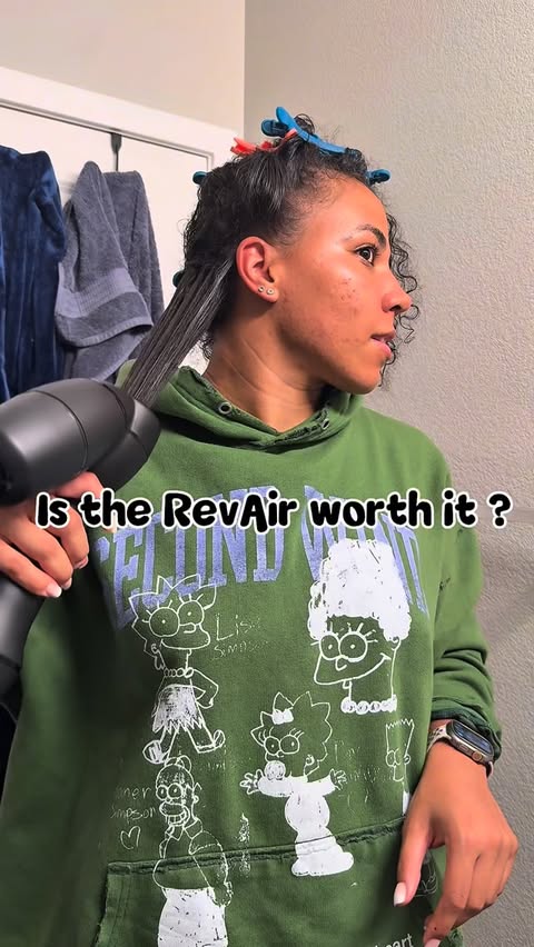 Instagram post by @dstnylttltn24 for RevAir • Reverse-Air Dryer. Caption reads: I have natural hair and I’ve never learned how to....