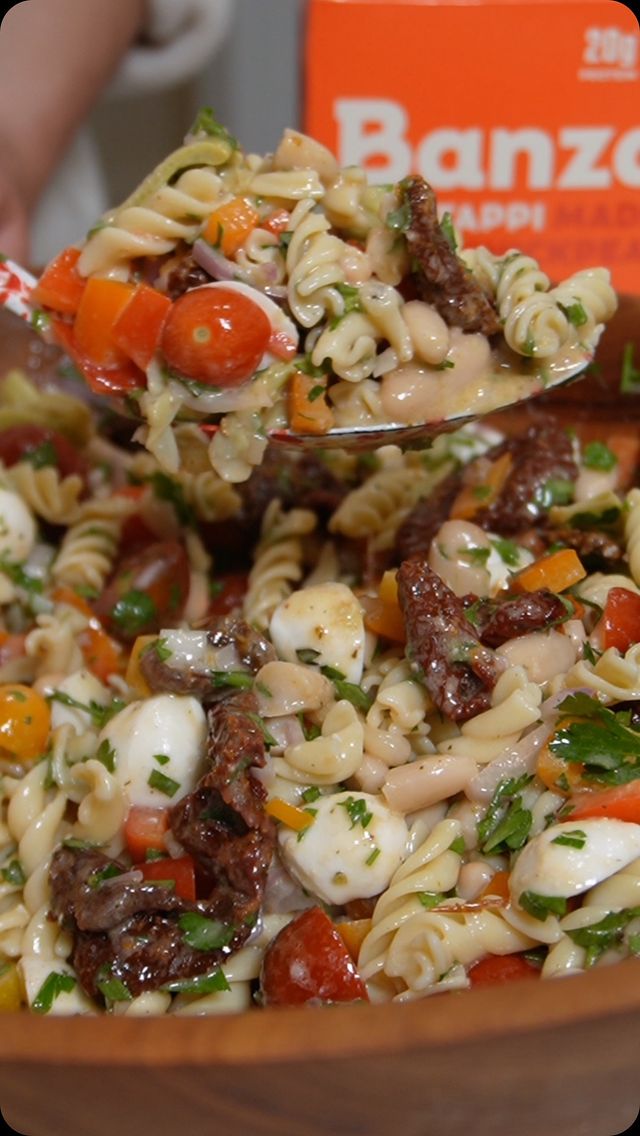 Instagram post by @violetwitchel for Banza. Caption reads: Sundried Tomato Dense Pasta Salad is perfect with....