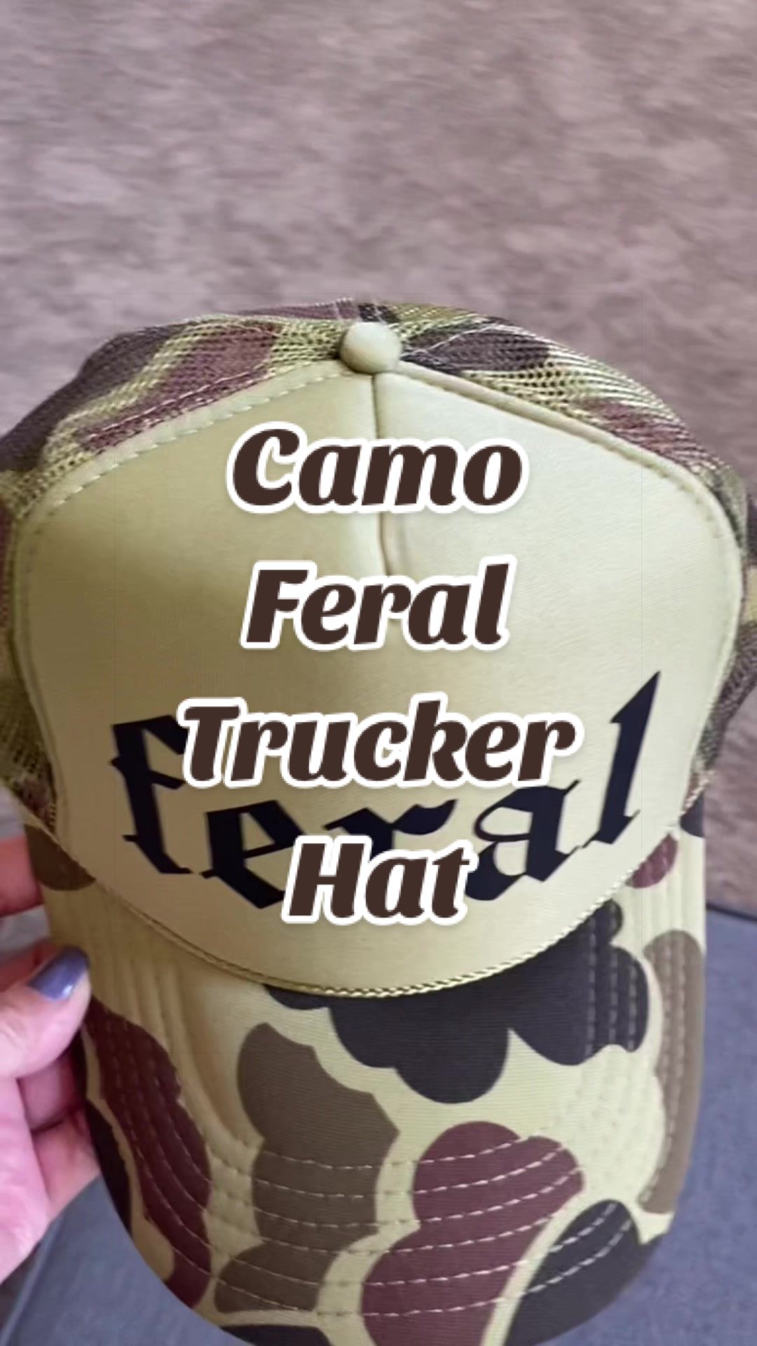 TikTok post by @mama5.finds for Refinery Number One. Caption reads: [...] #camoferalhat #camohat @Refinery Number One.