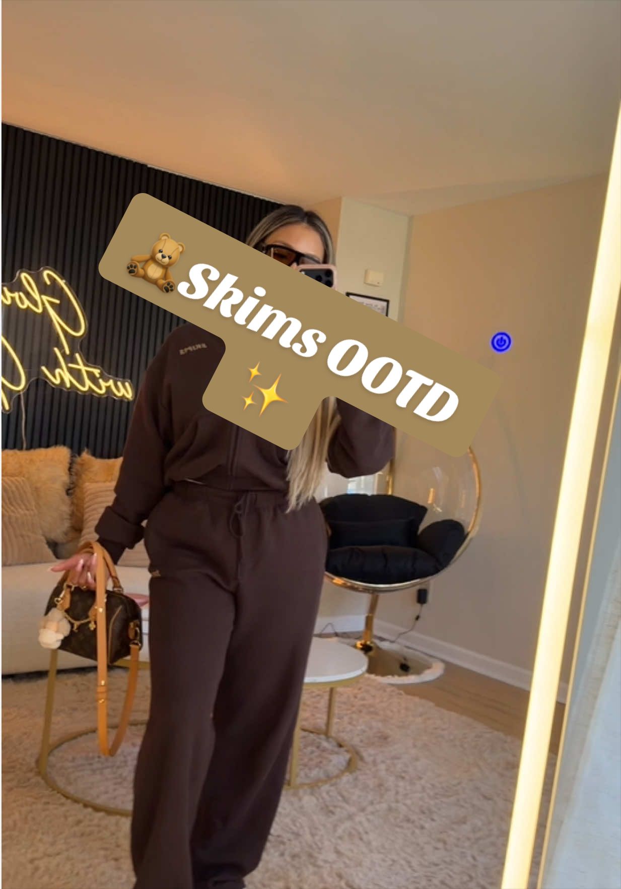 TikTok post by @giniglow for Skims. Caption reads: 🧸Skims Matching Set✨ Both hoodie & sweatpants in....