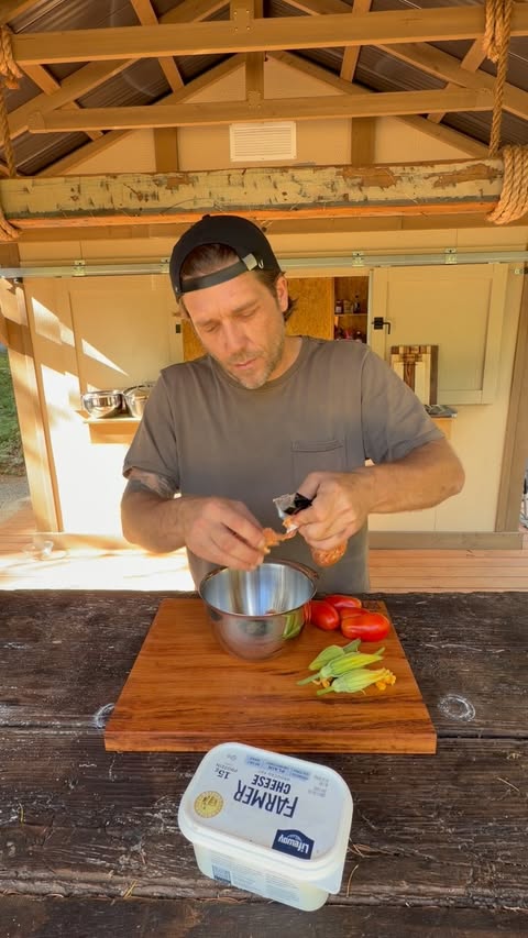 Instagram post by @chefadamglick for Lifeway Foods. Caption reads: Stuffed zucchini blossoms in Roma tomato sauce....