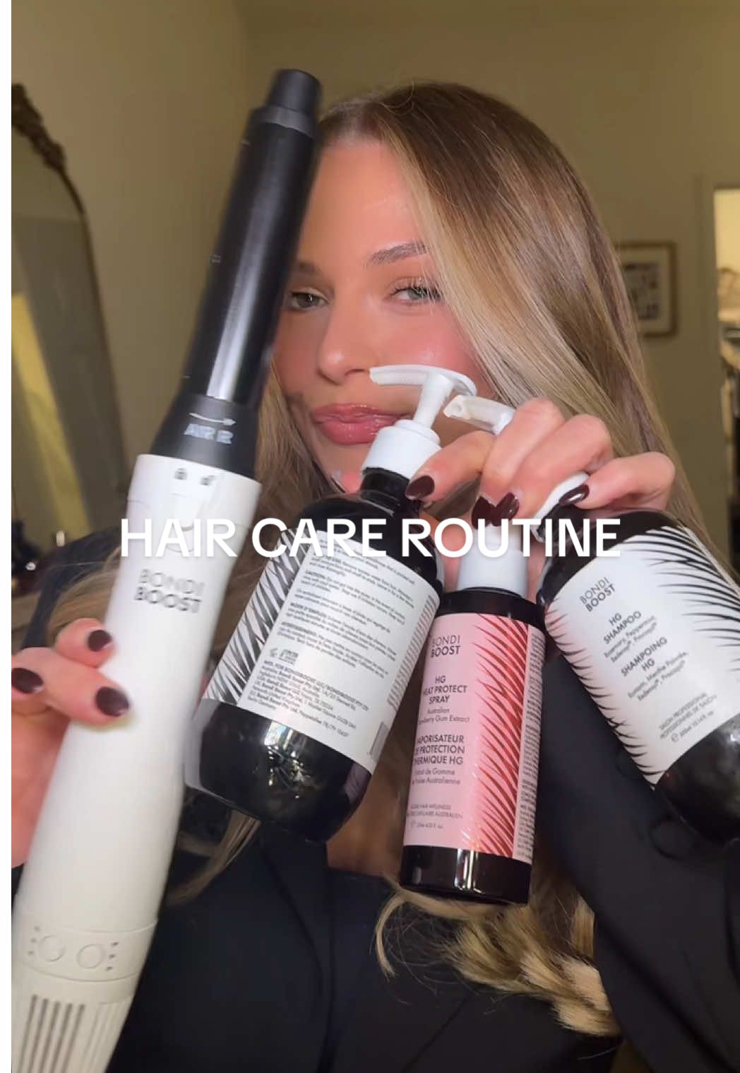 TikTok post by @shaanlew for BondiBoost. Caption reads: hair care routine !!!! Featuring all my favs from....