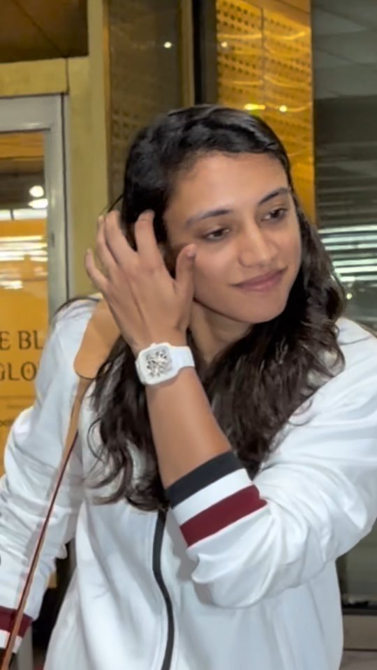 Instagram post by @manav.manglani for Rado. Caption reads: [...] Mandhana at the airport as she joins RADO as....