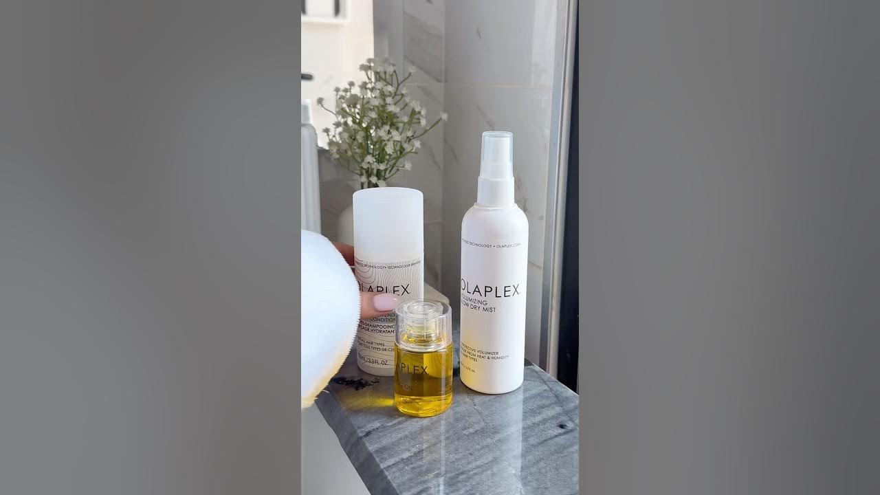 YouTube post by @Elysian.living for OLAPLEX. Caption reads: Hair wash day using @Olaplex No. 4 Fine Shampoo &....