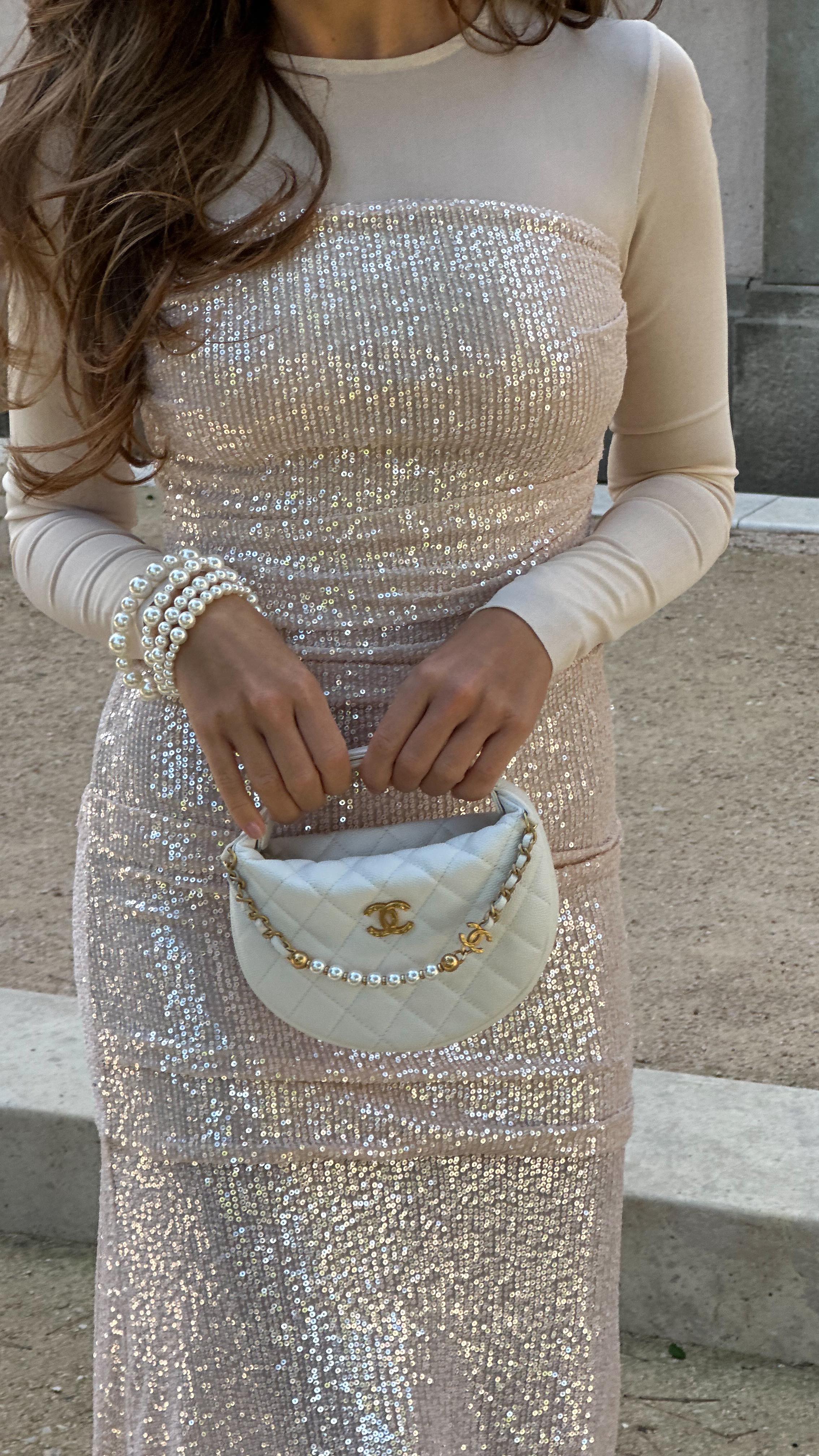 Instagram post by @sofiya_pa for Needle & Thread. Caption reads: Real elegance by @needleandthreadlondon ✨#ad.