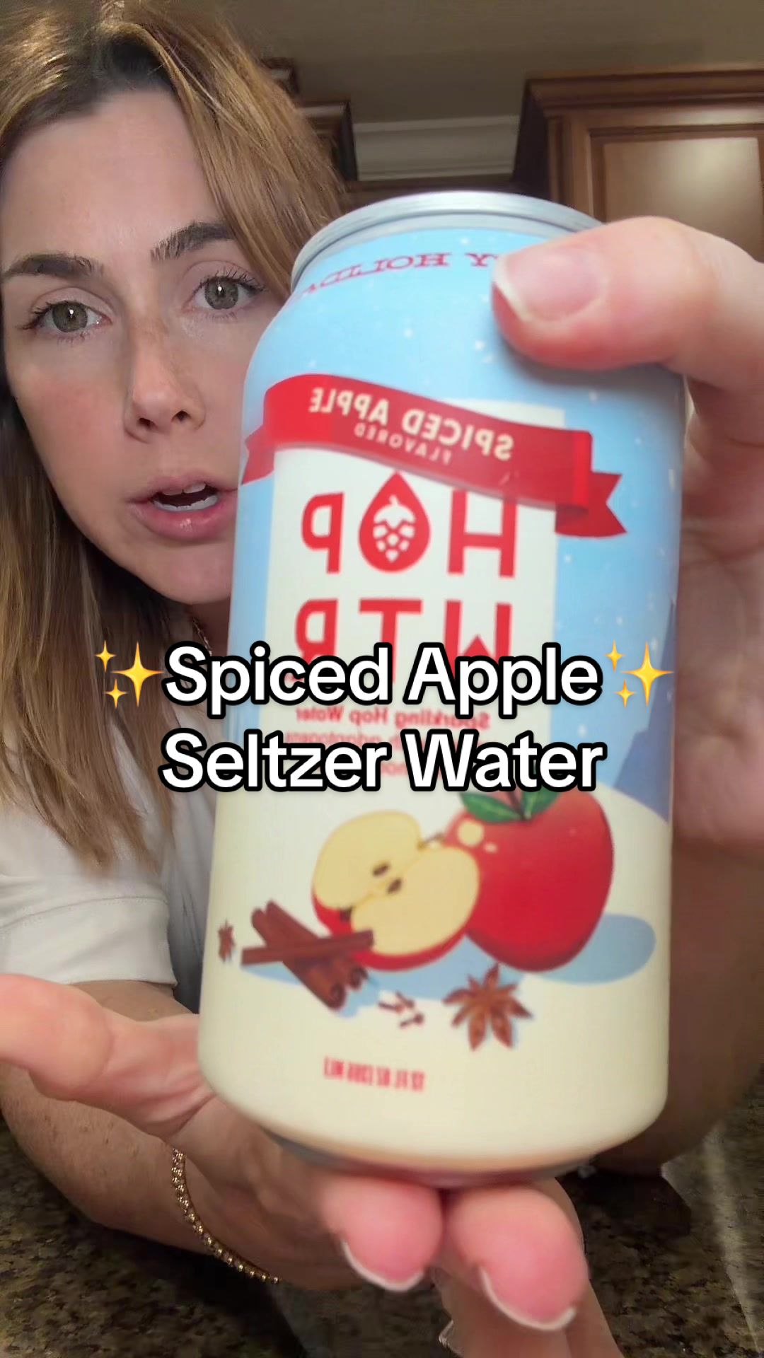 TikTok post by @jennah.samples for Hopwtr. Caption reads: Spiced apple flavored seltzer water! This is such....
