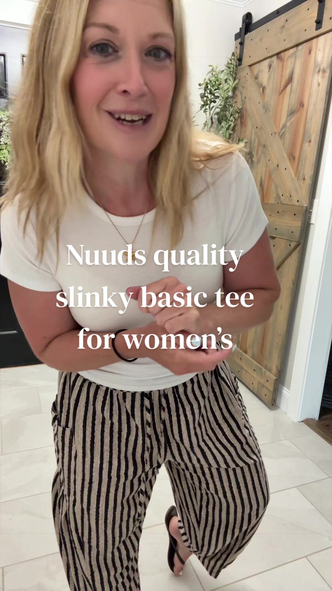 TikTok post by @wintheinch_wintheday for nuuds. Caption reads: [...] #whitetee #womensfashion #fashion @nuuds.