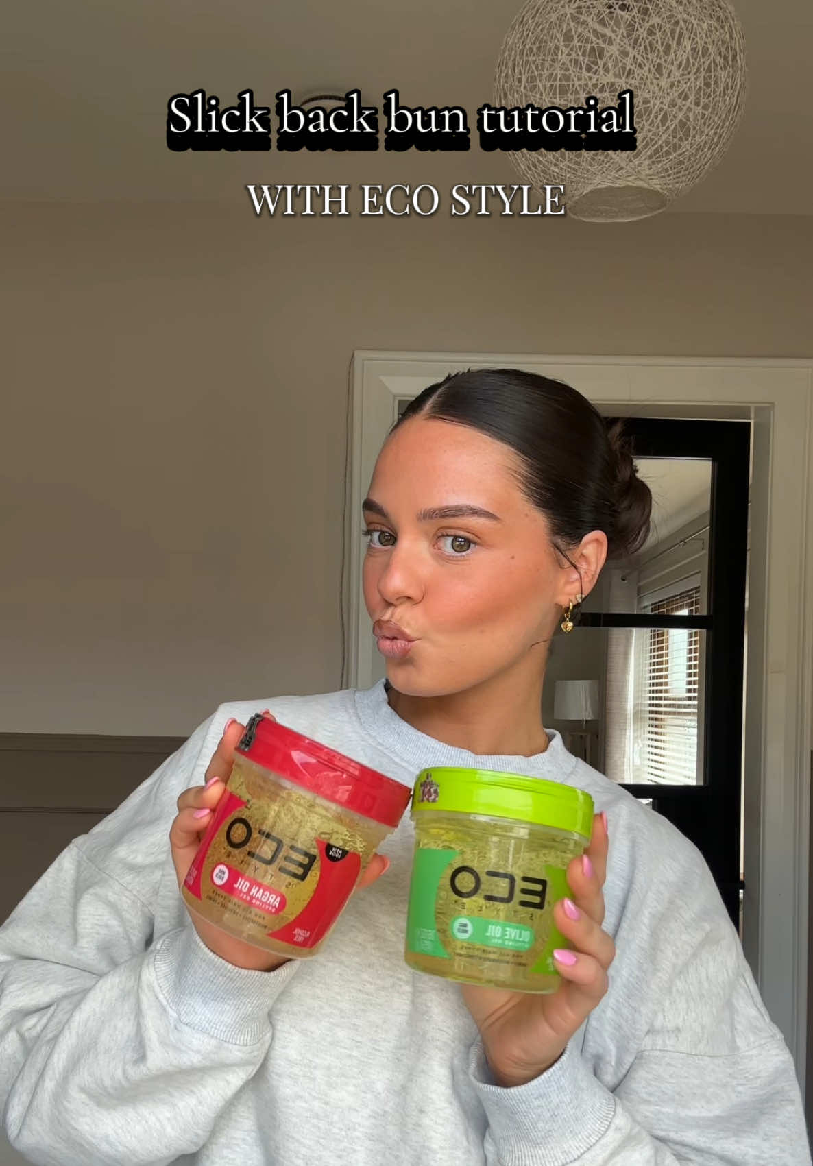 TikTok post by @megscleere for ECO Style. Caption reads: Slick back bun tutorial using @Eco Style ✨🫒💫👩🏽....