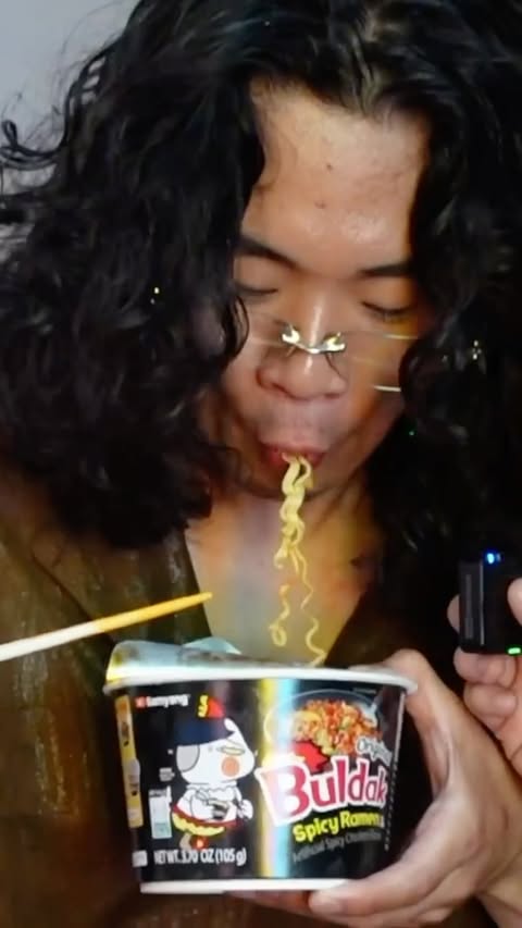 Instagram post by @tokyo_sims_ for Buldak. Caption reads: Lock in with spicy Buldak noodles @buldak_global....