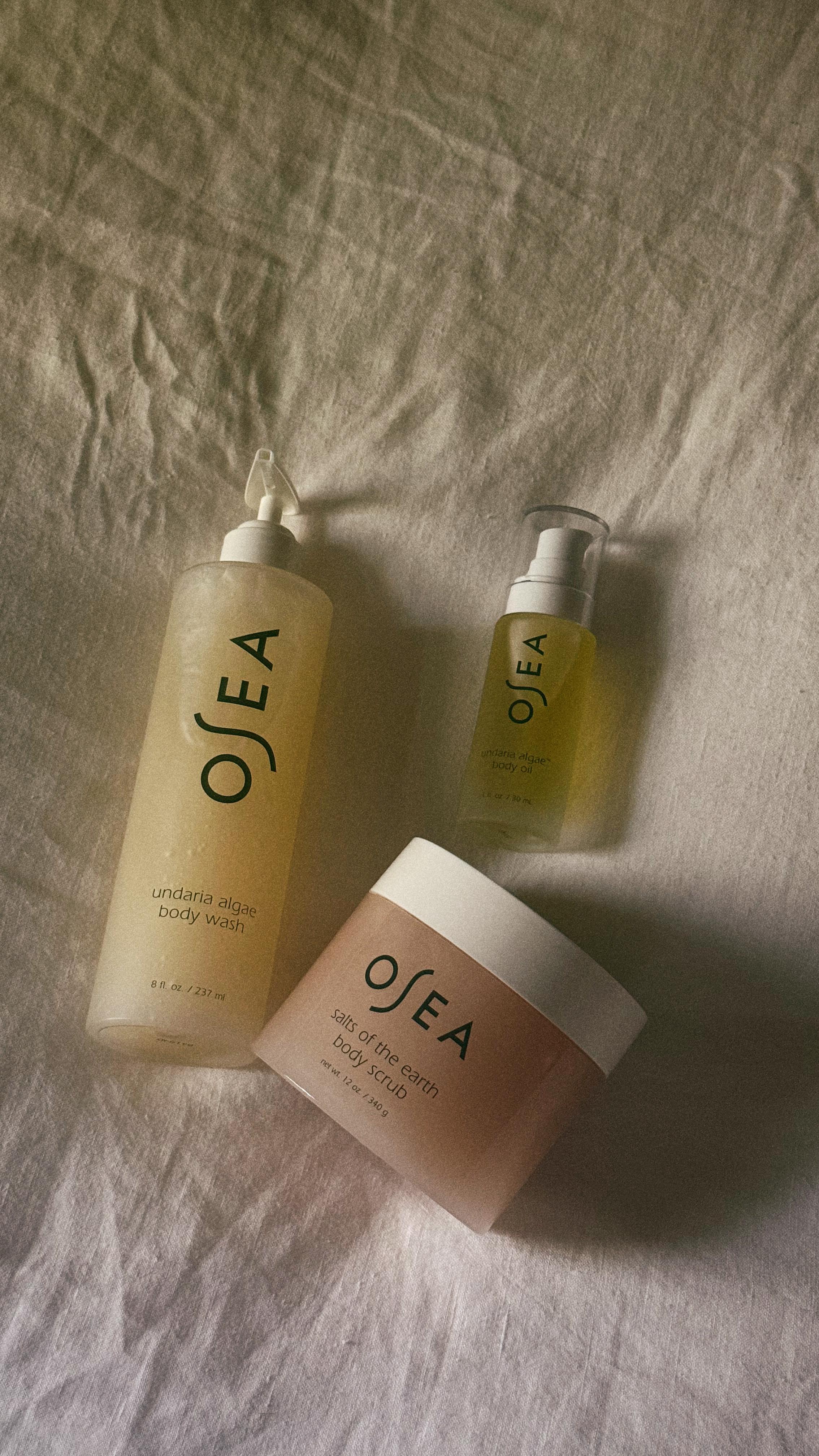 Instagram post by @maddiegreer for OSEA Malibu. Caption reads: The perfect glow for fall & winter 🤎

These....