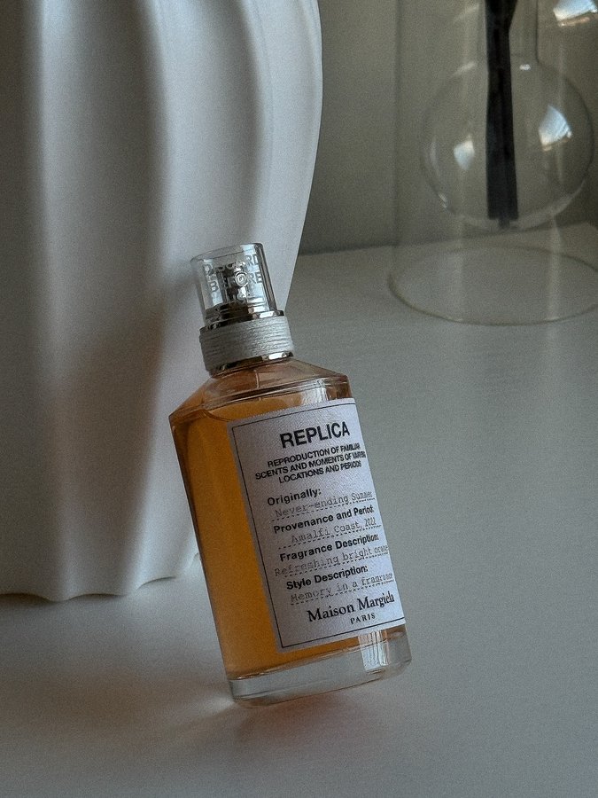 Instagram post by @amakasmellsgood for WPP. Caption reads: 🍊Never-ending Summer by @maisonmargielafragrances....