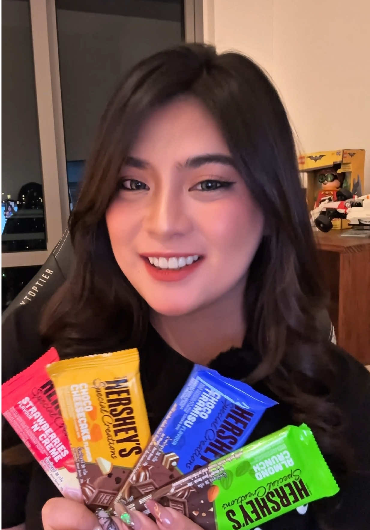 TikTok post by @cherizawa for Hersheyland. Caption reads: Lighten the mood and satisfy your sweet tooth....