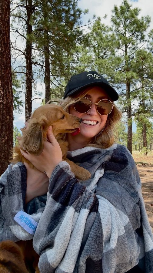 Instagram post by @danielleoutdoors_ for Snuggie. Caption reads: tell me if you had a snuggie growing up ⬇️

i got....