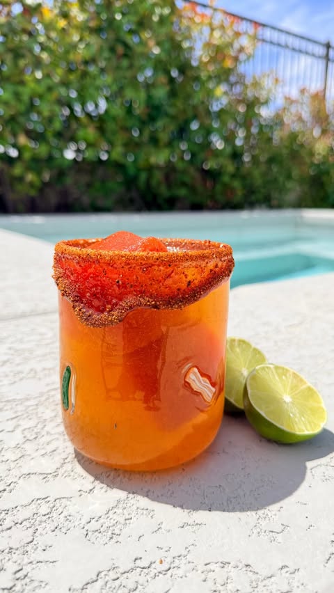 Instagram post by @redgoldtomatoes for The Feedfeed. Caption reads: #AD These Micheladas are perfect for summer with....