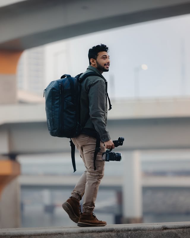 Instagram post by @jeetkhagram for NOMATIC. Caption reads: From city walks to long travel days, the @nomatic....