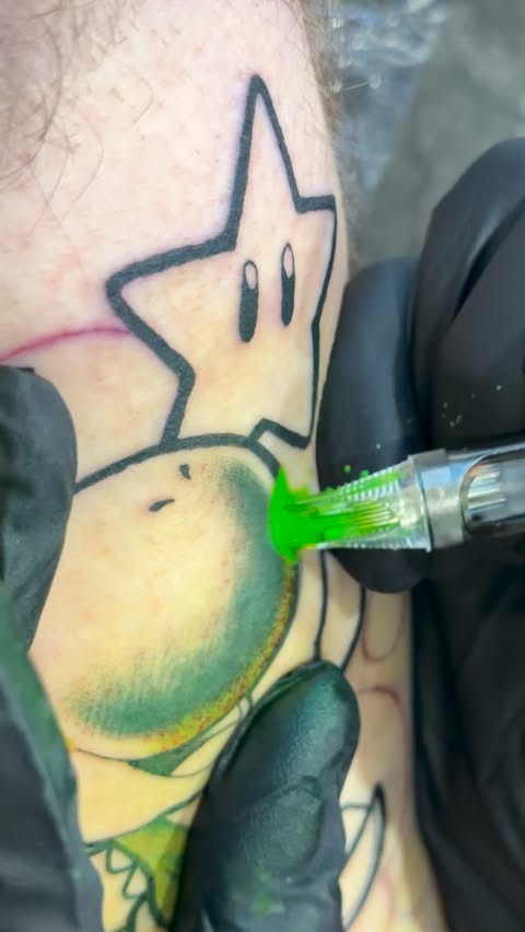 Instagram post by @animemasterink for World Famous Tattoo Ink. Caption reads: 💚 
.
Ready To Book? Link in Bio 👀
.
#nyctattoos....