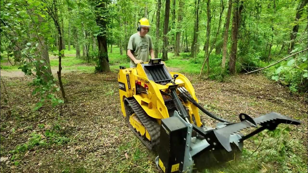 YouTube post by @MyClutteredGarage for audiio. Caption reads: Forestry Mulching with the Baumalight TRL630 mini....