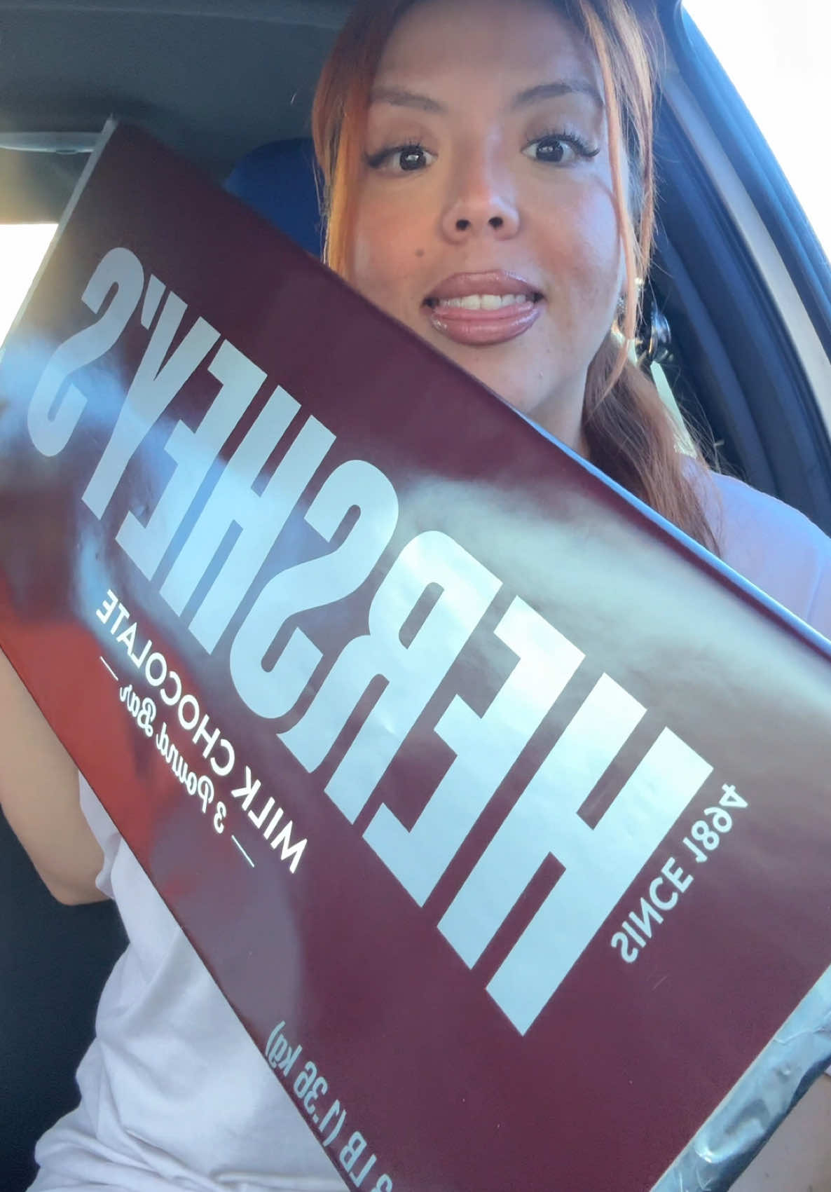 TikTok post by @theonly_iris for Hersheyland. Caption reads: Let’s eat a Giant 3 POUND Hershey’s Chocolate Bar....