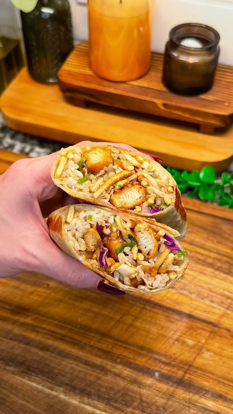 Instagram post by @cookwithauds for InnovAsian Cuisine. Caption reads: this asian fusion burrito has all the makings of a....
