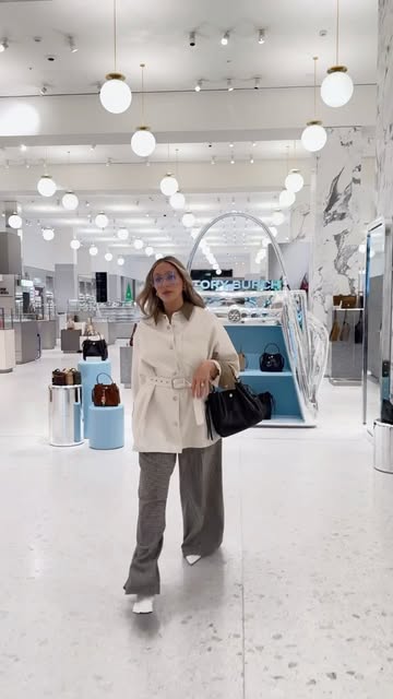 Instagram post by @charlotteleahcollins for Tory Burch. Caption reads: [...] good morning (and a very good new bag)....