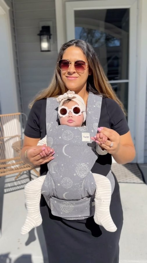 Instagram post by @lifeofkenziew for Baby Tula. Caption reads: We love our @babytula Explore Carrier!

Their....