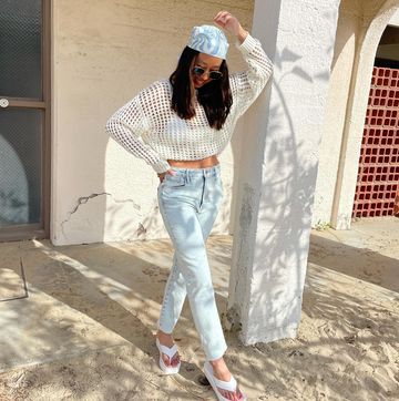 Instagram post by @erikascrublife for Dear John Denim. Caption reads: Sea la vie 🤌🏽 Top + jeans from @dearjohndenim .....