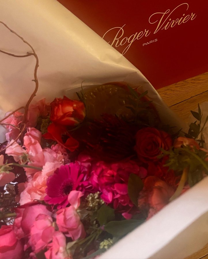 Instagram post by @tubabustun.official for Roger Vivier. Caption reads: Can we talk about the beauty of the roses without....