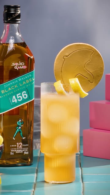 Instagram post by @squidgamenetflix for Johnnie Walker US. Caption reads: Introducing The 456 cocktail 🥃

The new Johnnie....