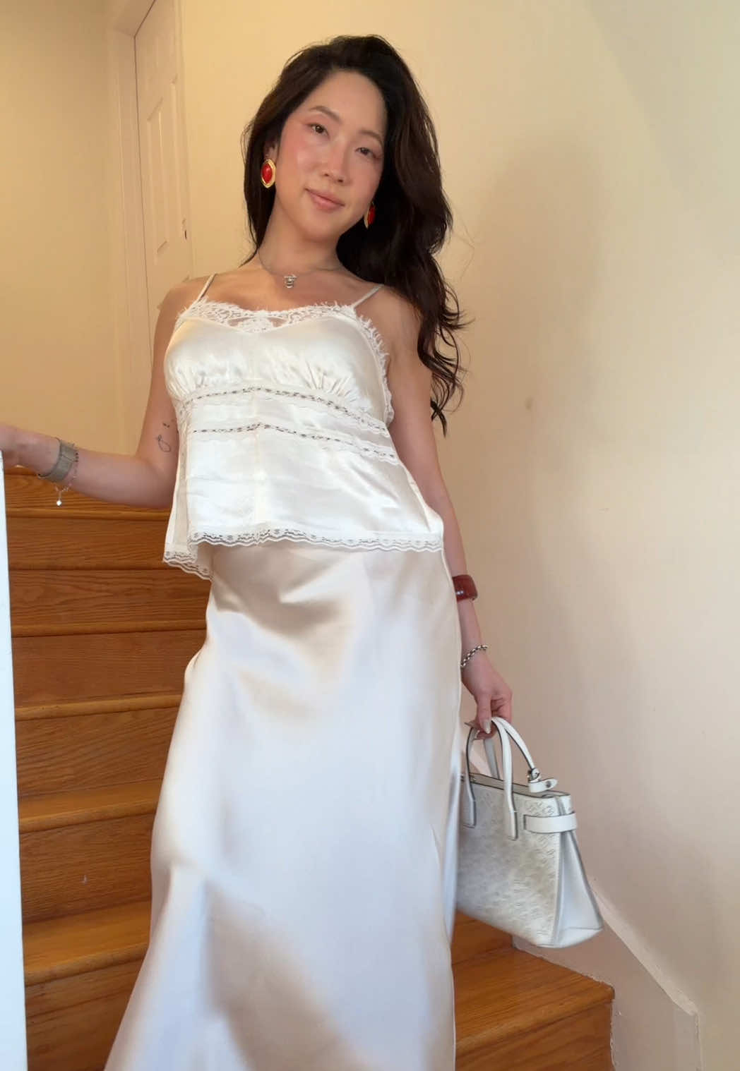 TikTok post by @hanahdewybae for 12th Tribe. Caption reads: [...] white clothes in my closet is insane @12TH....