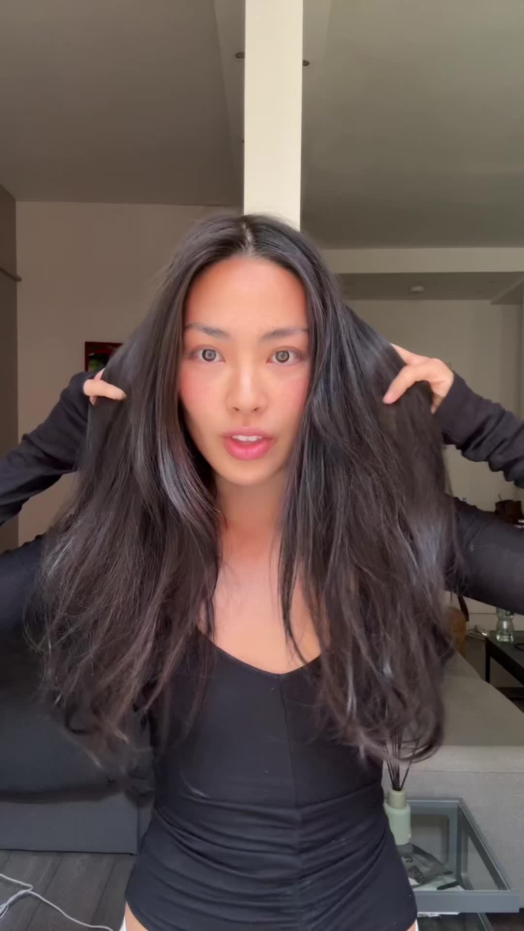 TikTok post by @shannonthebaby for OUAI. Caption reads: Never travel without @OUAI leave in conditioner....