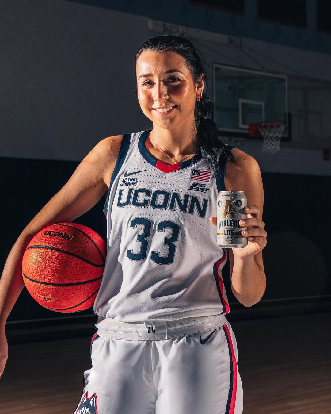 Instagram post by @caroline.ducharme3 for Athletic Brewing. Caption reads: My favorite postgame brew to celebrate the title....