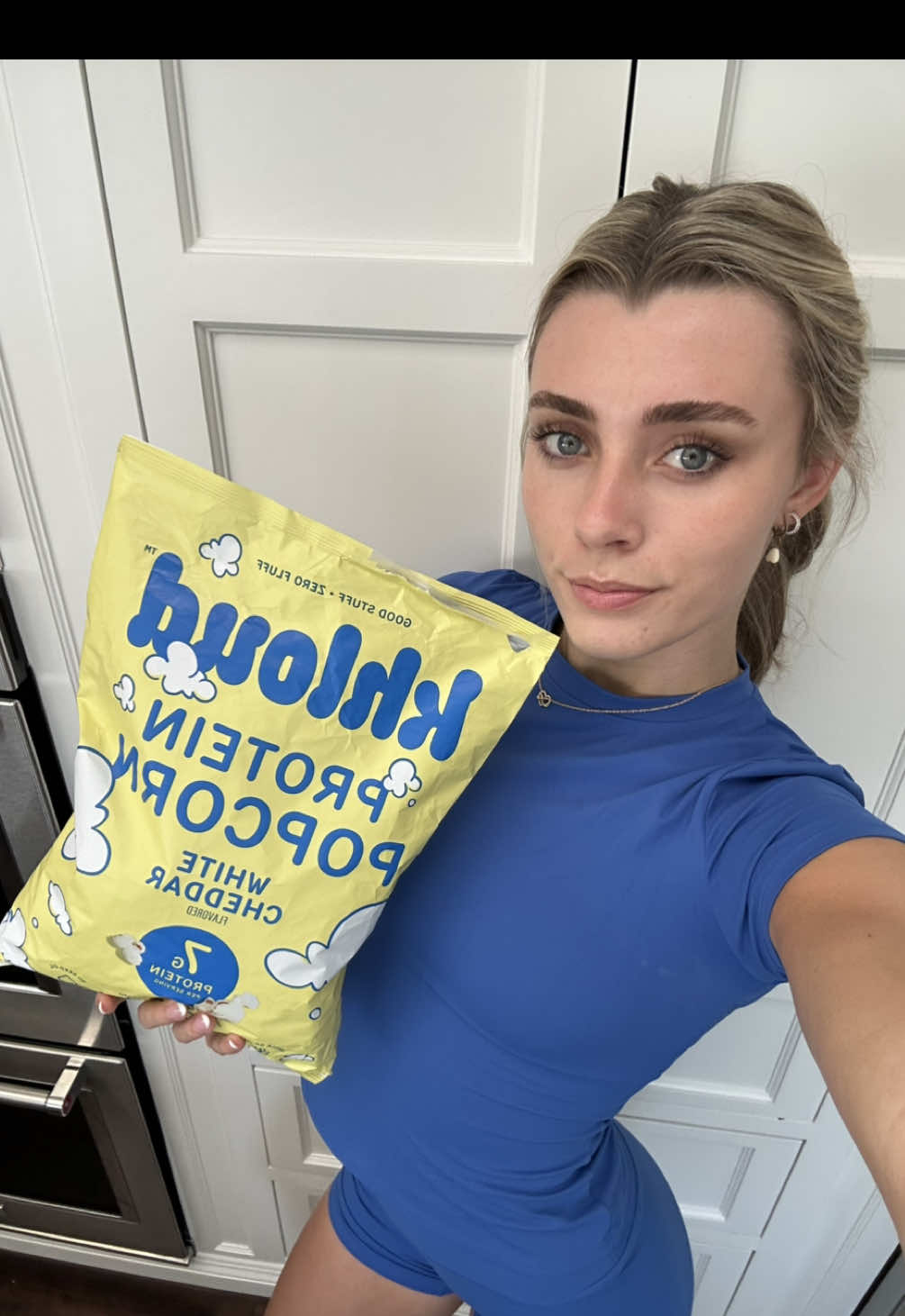 TikTok post by @macylemmon for Khloud. Caption reads: the best 🍿💖 @KhloudFoods #khloudcampusambassador.