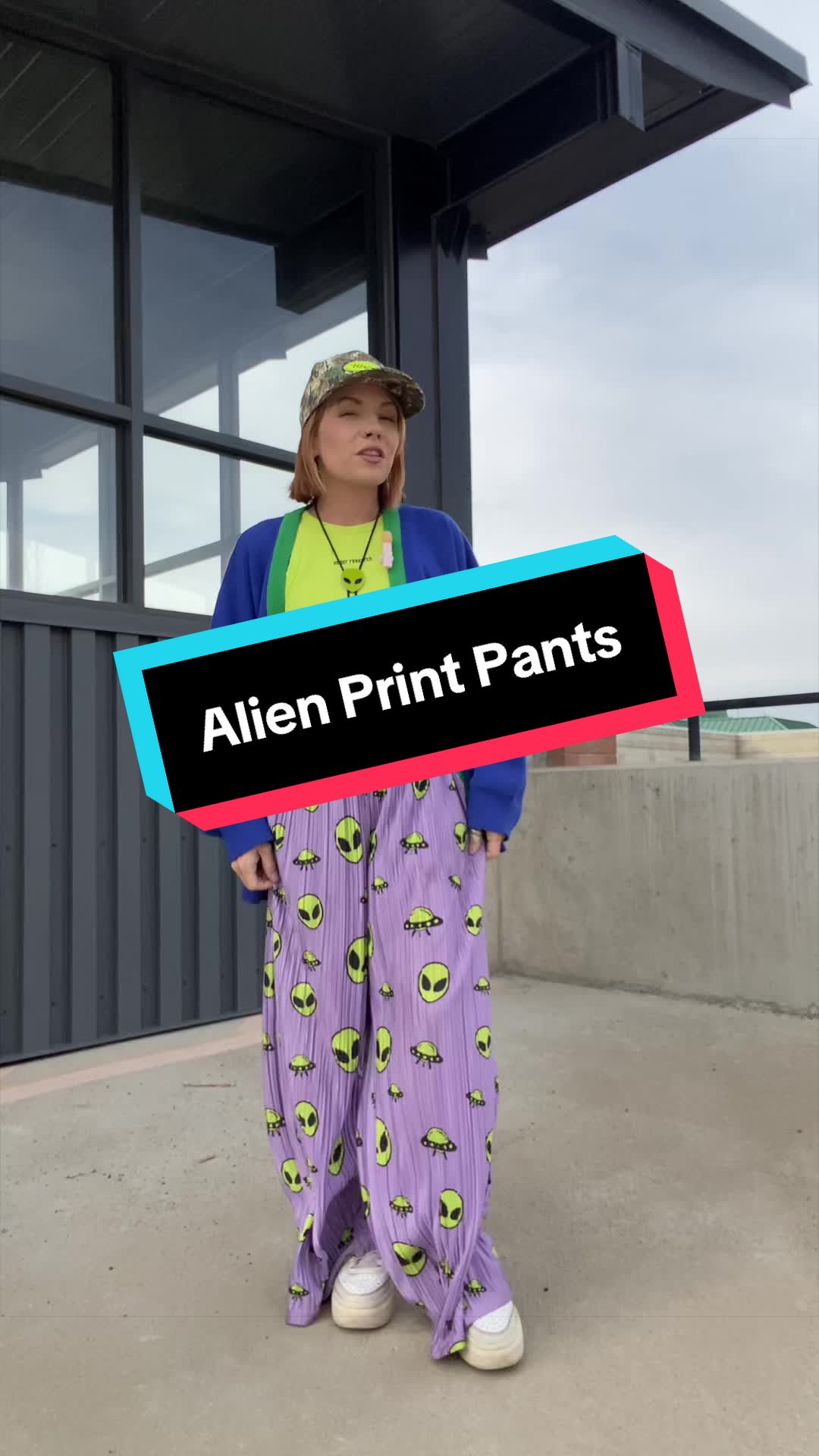 TikTok post by @miss.savvy.d for WKND Chasers. Caption reads: [...] #boldpants #plissepants #alienprint....