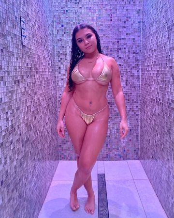 Instagram post by @therealelisemarie for Icon Swim. Caption reads: my man took these😍
gold bikini set from @iconswim....