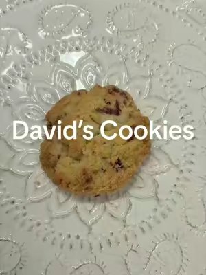 TikTok post by @bitesizedreviewstv for David's Cookies. Caption reads: [...] are giving everything right @David's Cookies....