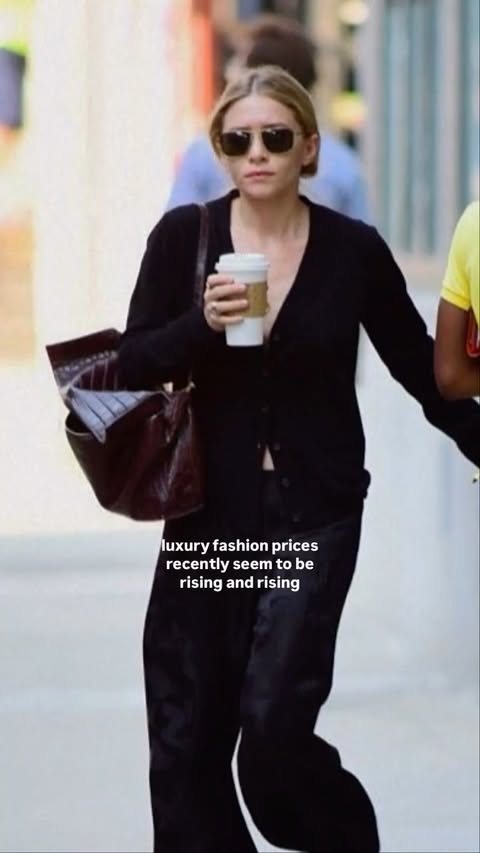 Instagram post by @databutmakeitfashion for The Row. Caption reads: can a luxury brand be *tooo exclusive?? 👜👀💸....