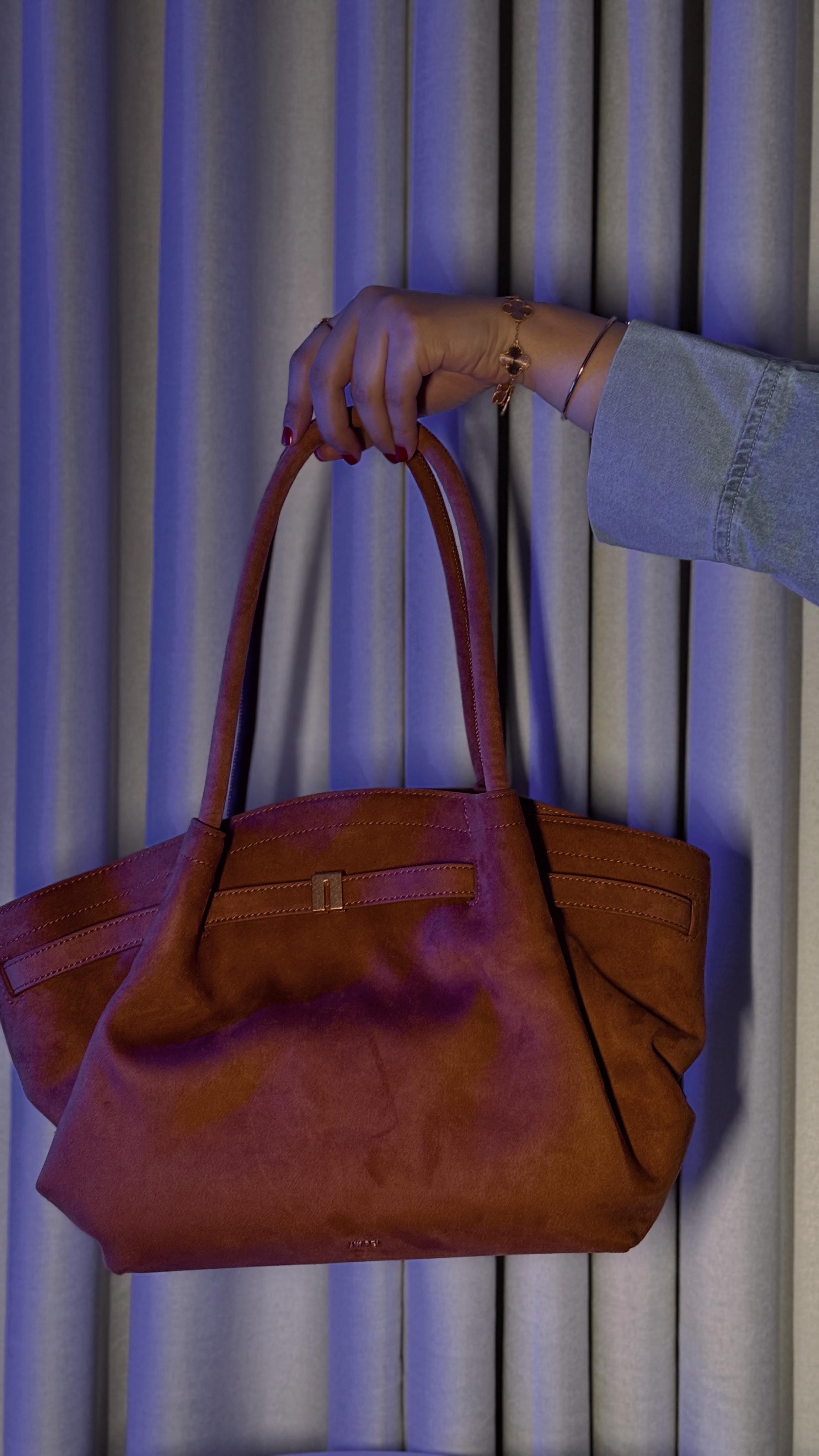 Instagram post by @ayahtarekofficial for JW PEI. Caption reads: HANA MEDIUM COLLECTION....