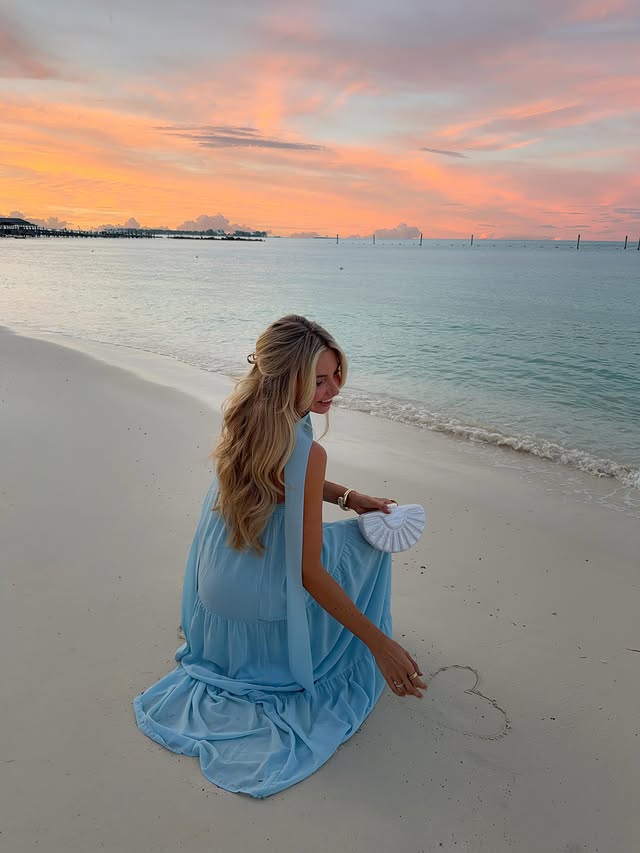 Instagram post by @solarpowered_blonde for Hello Molly. Caption reads: the perfect vacation dress @hellomolly 🤍code....