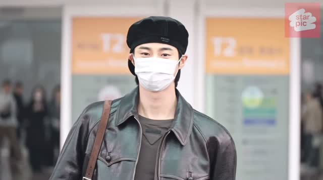 Instagram post by @byeonwooseokfeed for Prada. Caption reads: [...] Airport Departing to Milan to attend the....