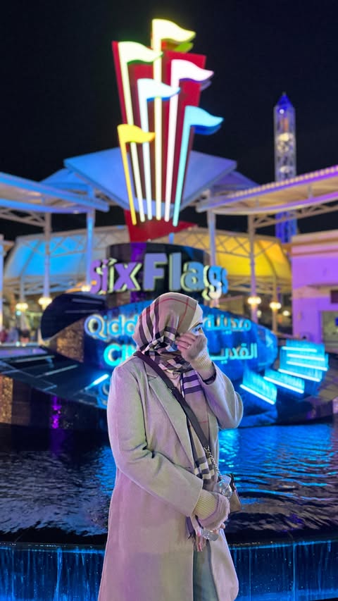 Instagram post by @aesthetically.amna for Six Flags. Caption reads: Invite-only visit to Six Flags Qiddiya City🎢✨ And....