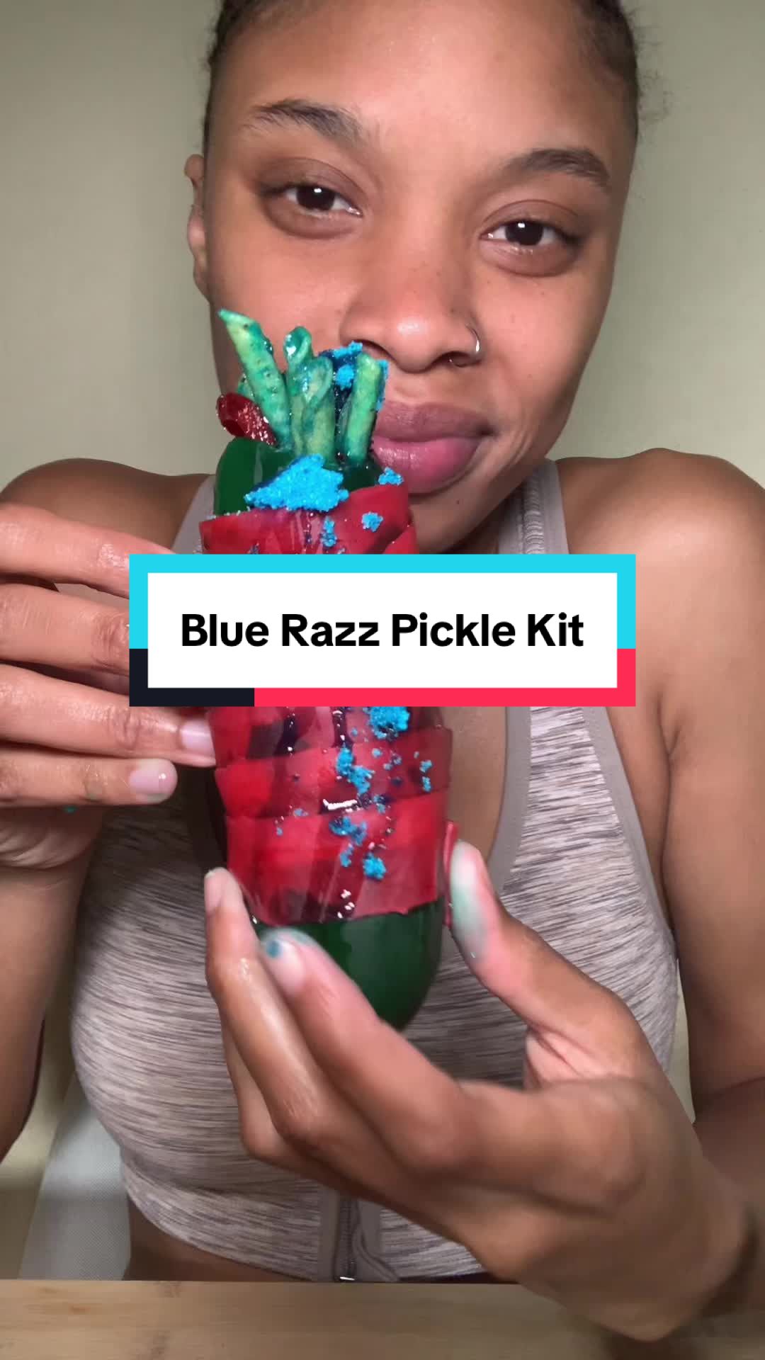 TikTok post by @designer_bagpro for Sourboy Snacks. Caption reads: I love the BLUERAZZ PICKLE 💙 @sourboychamoy....