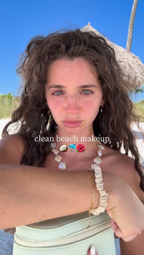 Instagram post by @r.m.ray for Nude by Nature. Caption reads: [...] skin, even at the beach✨ check out....