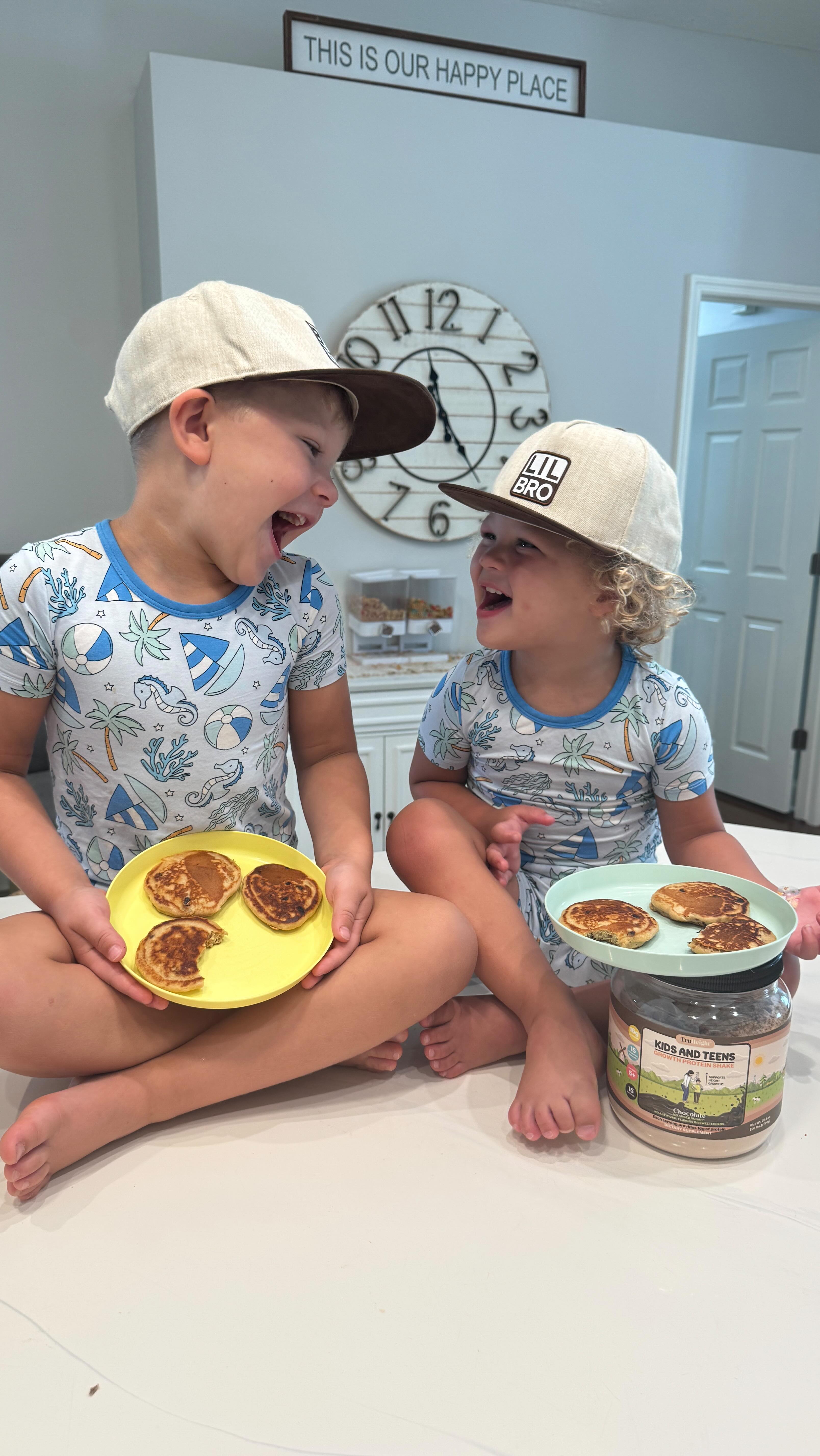 Instagram post by @bridgetjbeck for TruHeight Vitamins. Caption reads: Tiny chefs, huge gains—protein pancakes stronger....