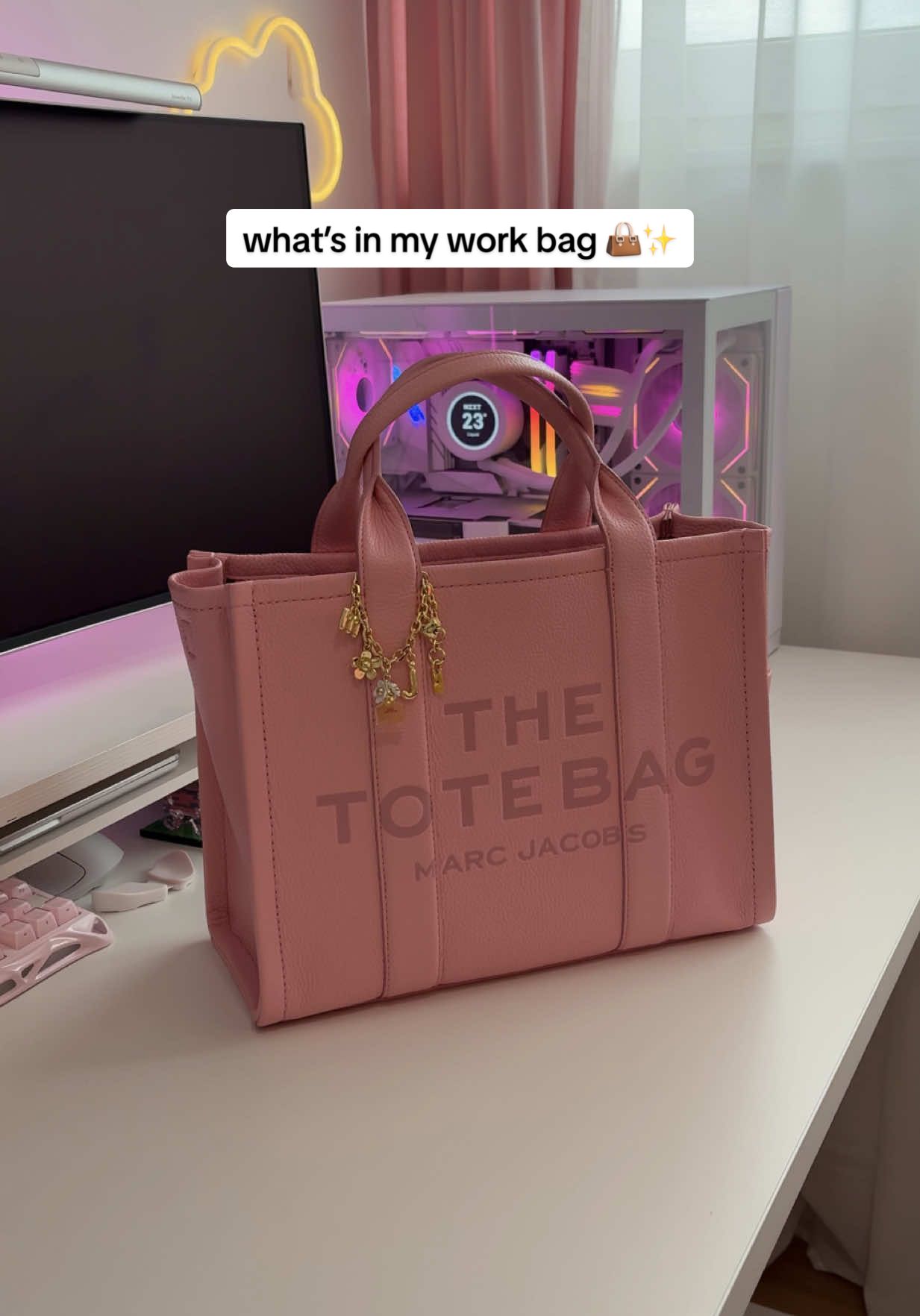 TikTok post by @isiomavlogs for Marc Jacobs. Caption reads: what’s in my work bag 👜✨ {ad} I usually work from....