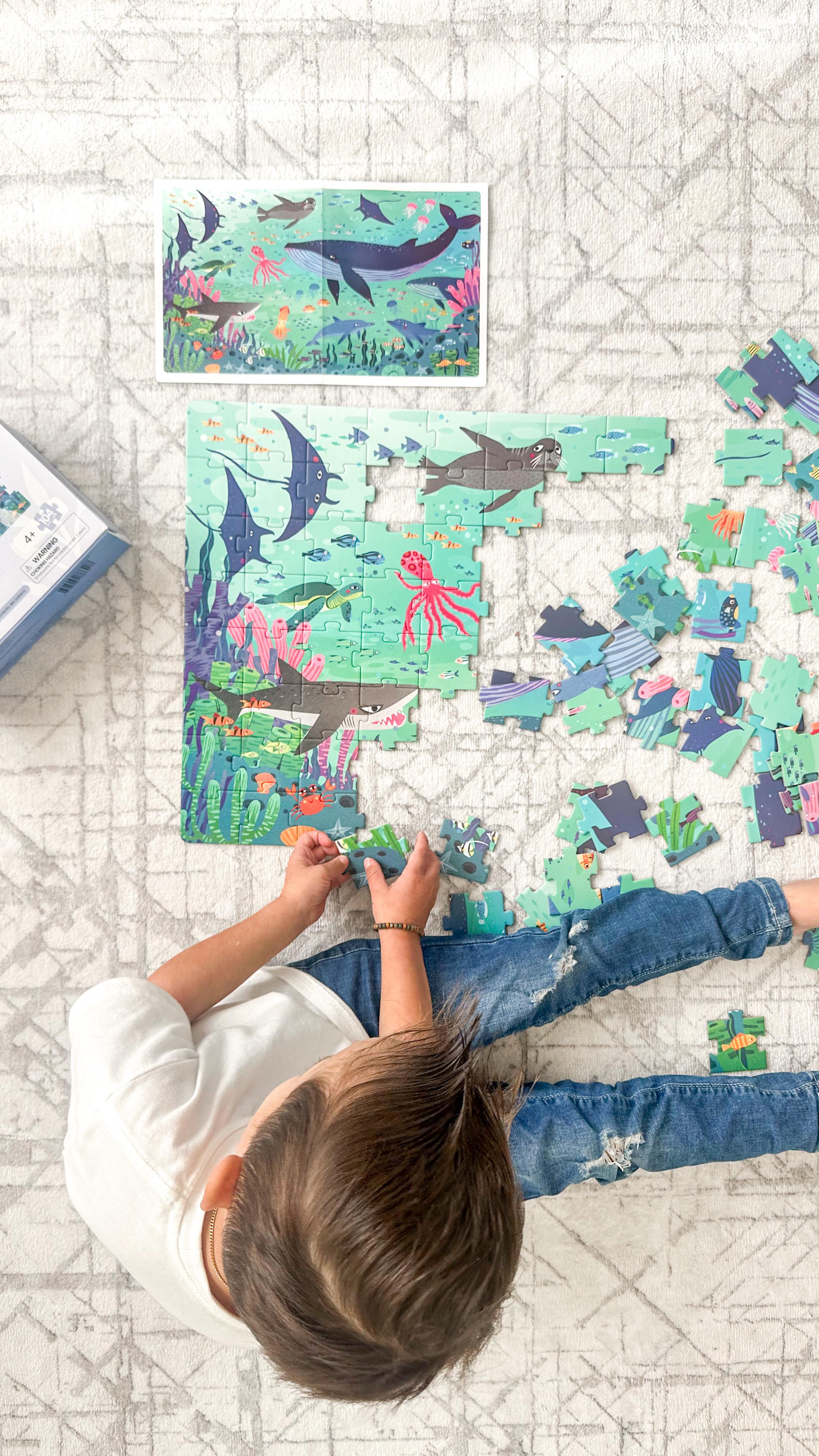 Instagram post by @kristinaandco_ for Coco Village. Caption reads: For the little puzzle lover 🎁 🐳🧩 The....