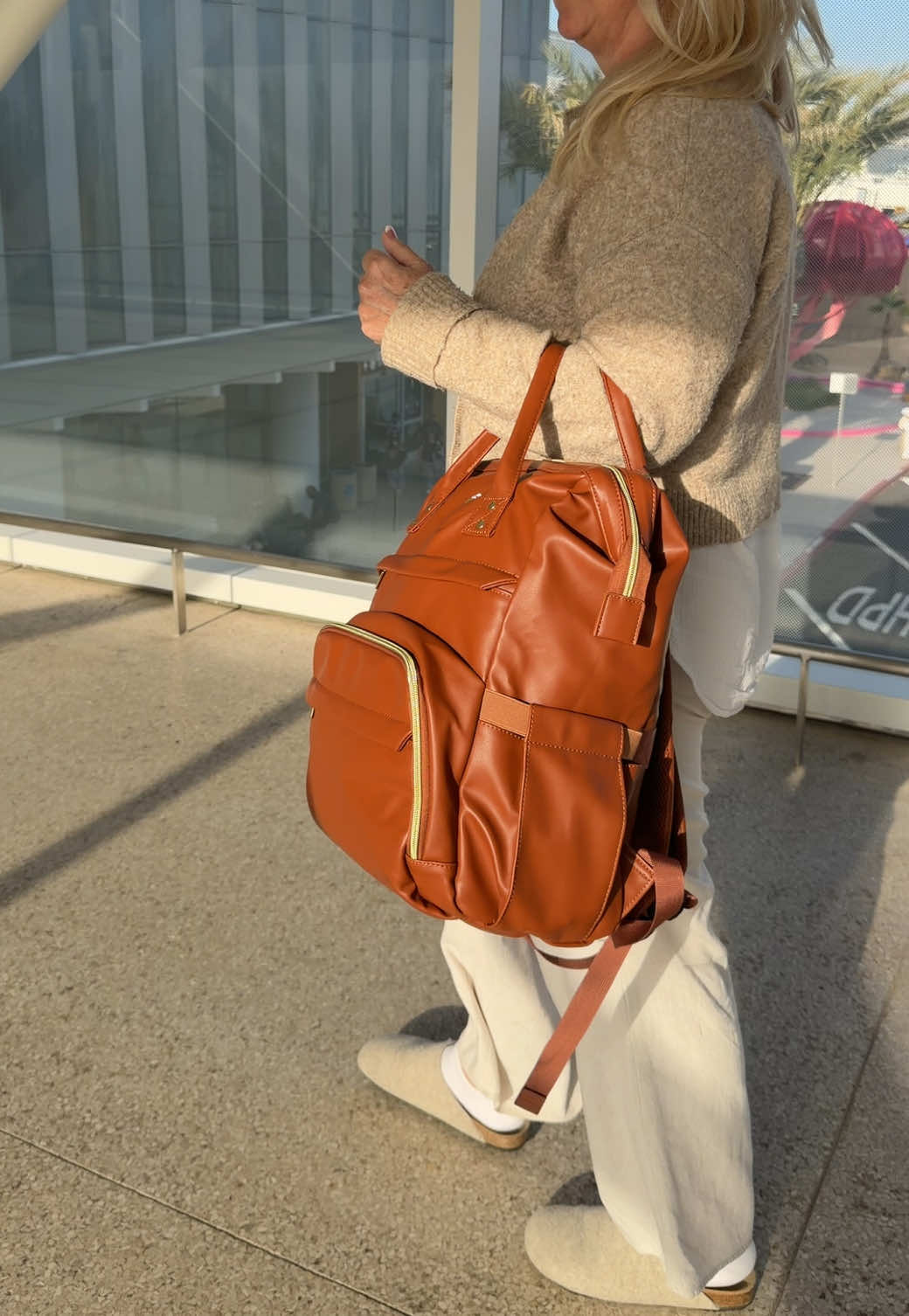 TikTok post by @sueandherhome for Lovevook. Caption reads: Vegan Leather Backpack with USB port @Lovevook....