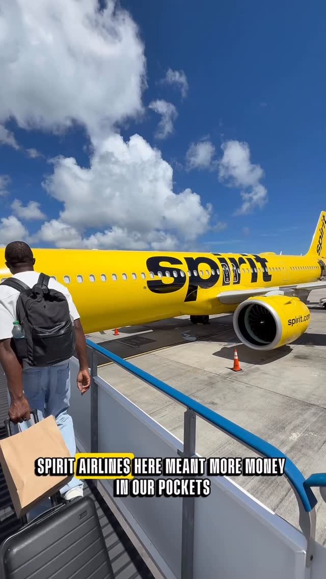 Instagram post by @thetravelingchild for Spirit Airlines. Caption reads: St. Maarten was paradise: stunning beaches,....