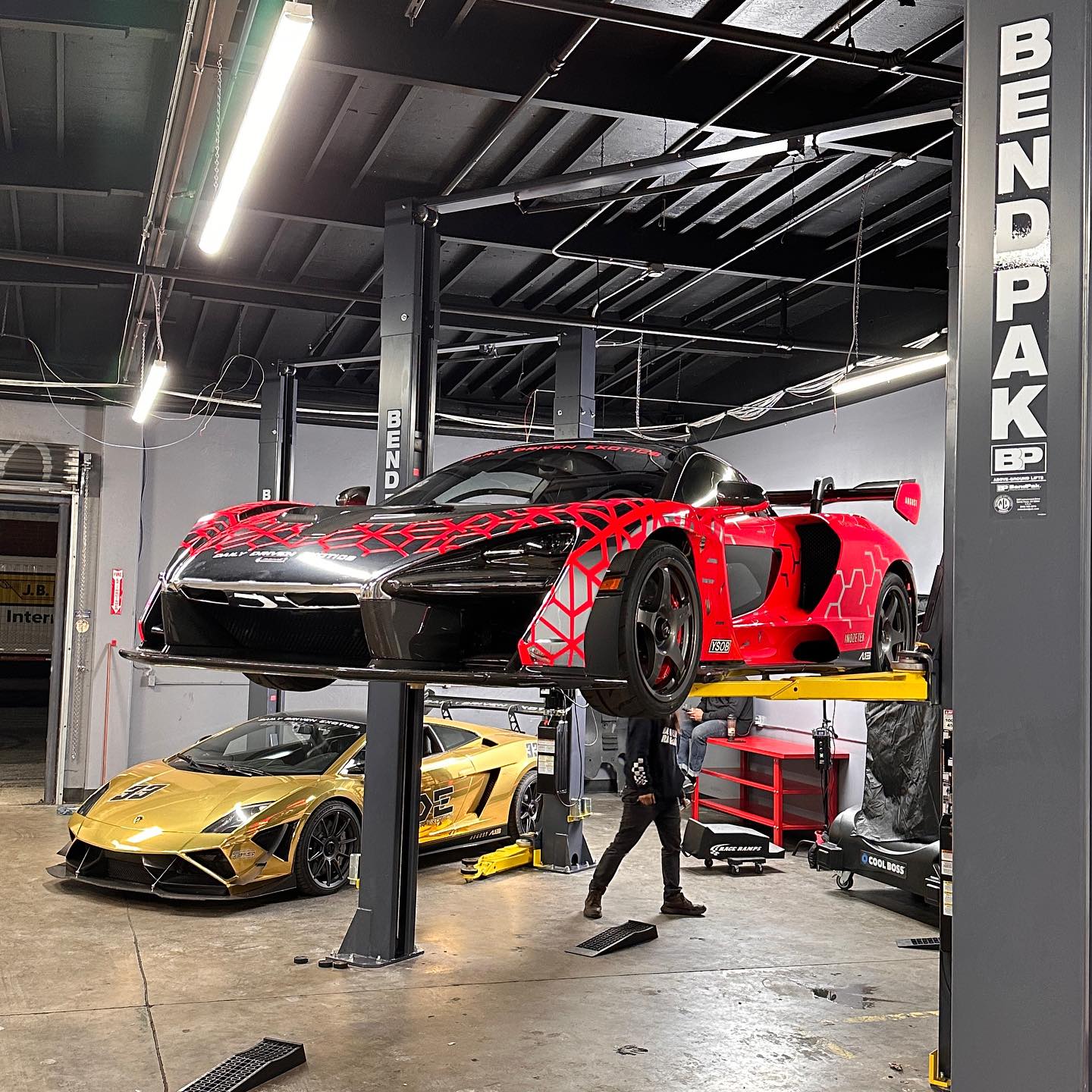 Instagram post by @dailydrivenexotics for BendPak. Caption reads: IYKYK @bendpak make lifts for everything.....