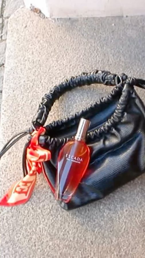 Instagram post by @girlcalledluca for Escada Fragrances. Caption reads: Nostalgia & confidence with @escadafragrances 🧡
-....